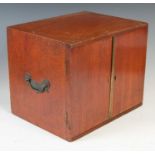 A 19th century mahogany coin collectors tabletop cabinet, the pair of cupboard doors opening to a