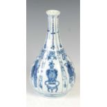 A Chinese porcelain blue and white pear-shaped vase, Qing Dynasty, the fluted body decorated with