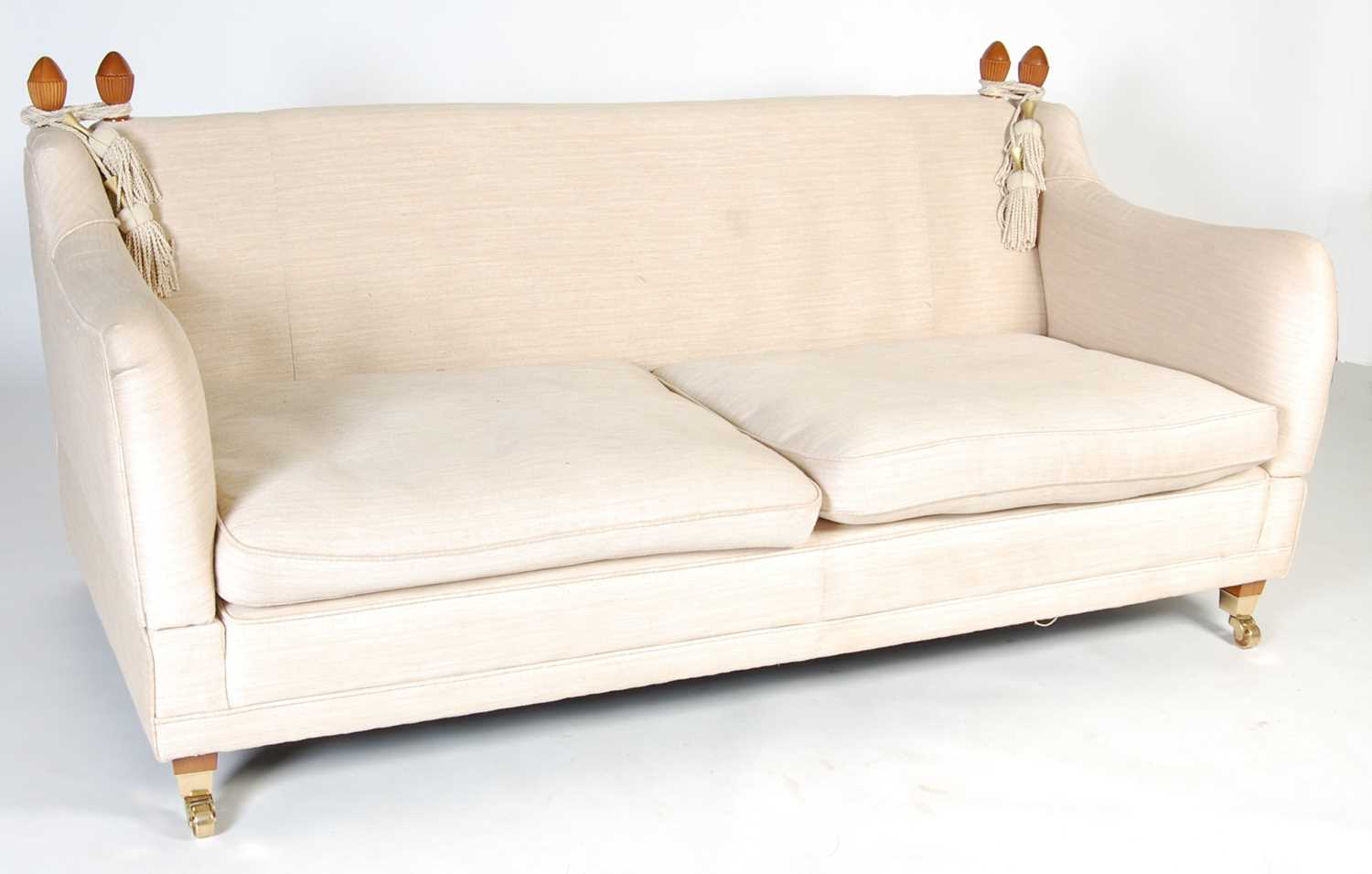 A Country House style drop-end sofa, the rectangular seat with two loose cushions with each arm