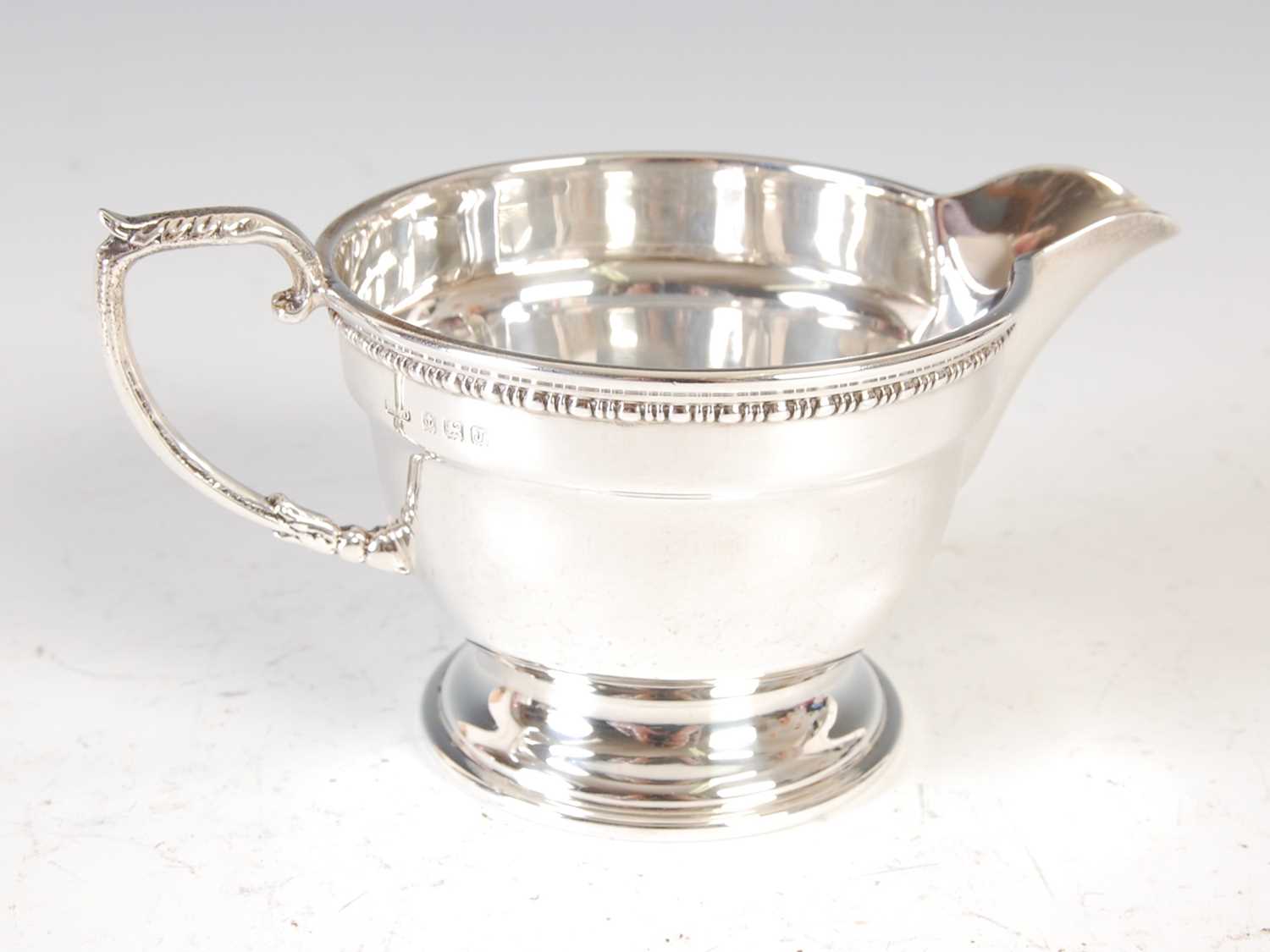 A George V three-piece silver tea set, Birmingham, 1933, makers mark of 'R&D', gross weight 19.6 - Image 12 of 15