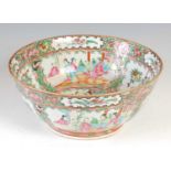 A Chinese porcelain famille rose Canton punch bowl, Qing Dynasty, decorated with panels of figures