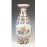 A Chinese porcelain famille rose pear-shaped vase, 20th century, decorated with rectangular panels