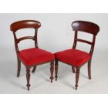 A matched set of eight Victorian mahogany balloon back dining chairs, comprising two similar sets of
