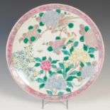 A famille rose palette porcelain charger, decorated with peony, flowering branch and two long-tailed