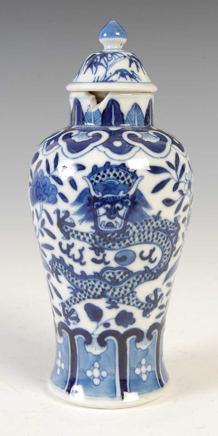 A Chinese porcelain blue and white jar and matched cover, Qing Dynasty, decorated with a pair of