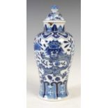 A Chinese porcelain blue and white jar and matched cover, Qing Dynasty, decorated with a pair of