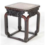 A Chinese dark wood and mother of pearl inlaid urn stand, Qing Dynasty, the square shaped top with