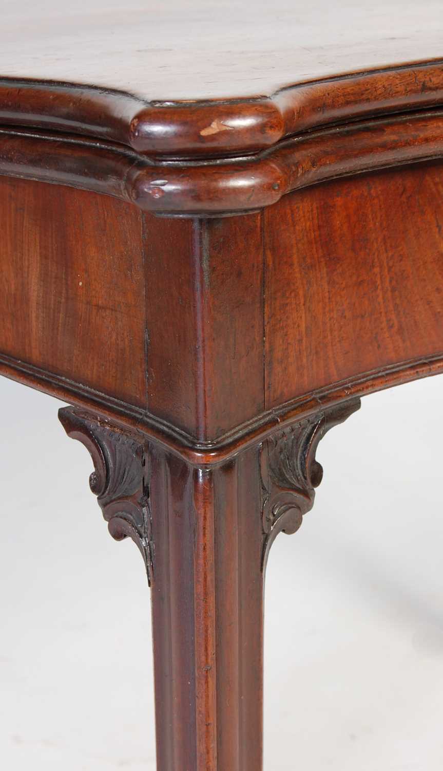 A George III mahogany serpentine card table, the shaped top with moulded edge opening to a green - Image 4 of 12