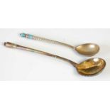 A Russian silver gilt and cloisonne enamel spoon, Moscow, 1887, 13cm long, together with another