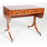 A 19th century rosewood, ebony and boxwood lined sofa table, the rectangular top with twin drop