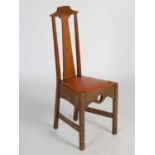 An early 20th century oak Arts & Crafts side chair, the splat inlaid with stylised flower, with