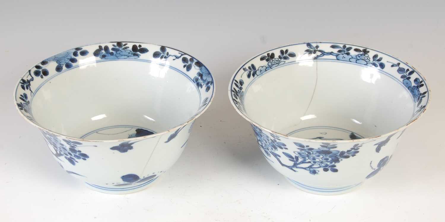 A pair of Chinese porcelain blue and white bowls, Qing Dynasty, the exteriors decorated with