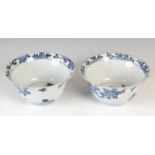 A pair of Chinese porcelain blue and white bowls, Qing Dynasty, the exteriors decorated with