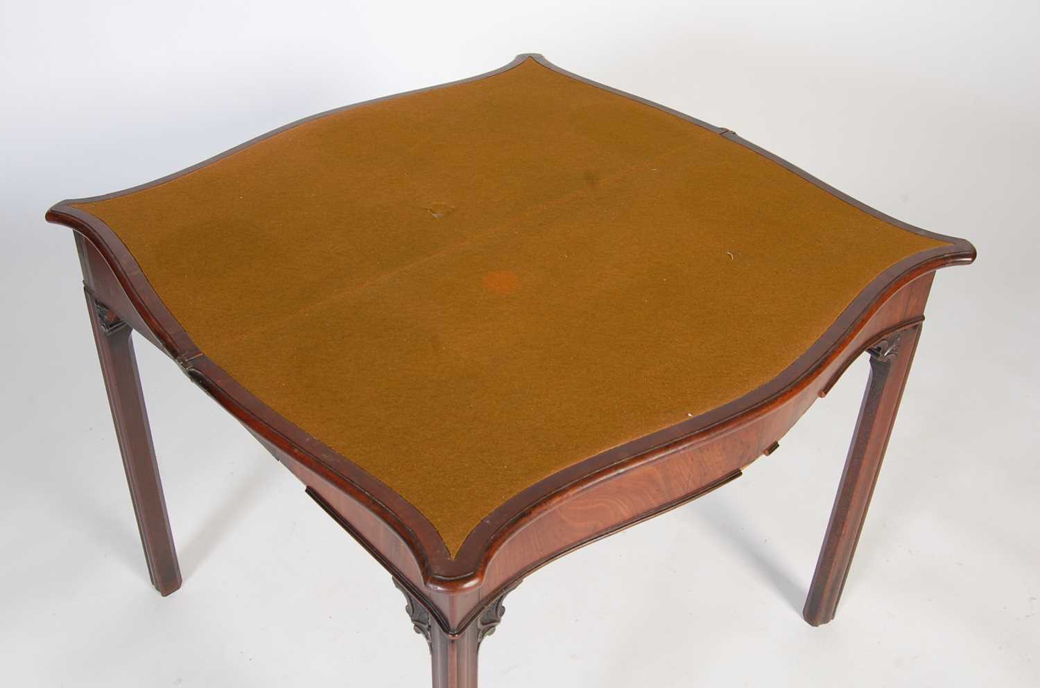 A George III mahogany serpentine card table, the shaped top with moulded edge opening to a green - Image 9 of 12