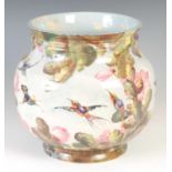 A late 19th/ early 20th century hand-painted pottery jardiniere, decorated with humming birds and