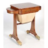 A 19th century Regency style rosewood and brass inlaid work table, the hinged rectangular top with