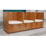 An early 20th century Art Deco walnut settle, with three-division seat section enclosing cream