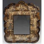 A mid 17th century stumpwork and lacquer mirror dated 1652, the rectangular mirror plate within a