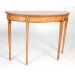 A 19th century painted satinwood and rosewood banded demi lune console table, the shaped top with