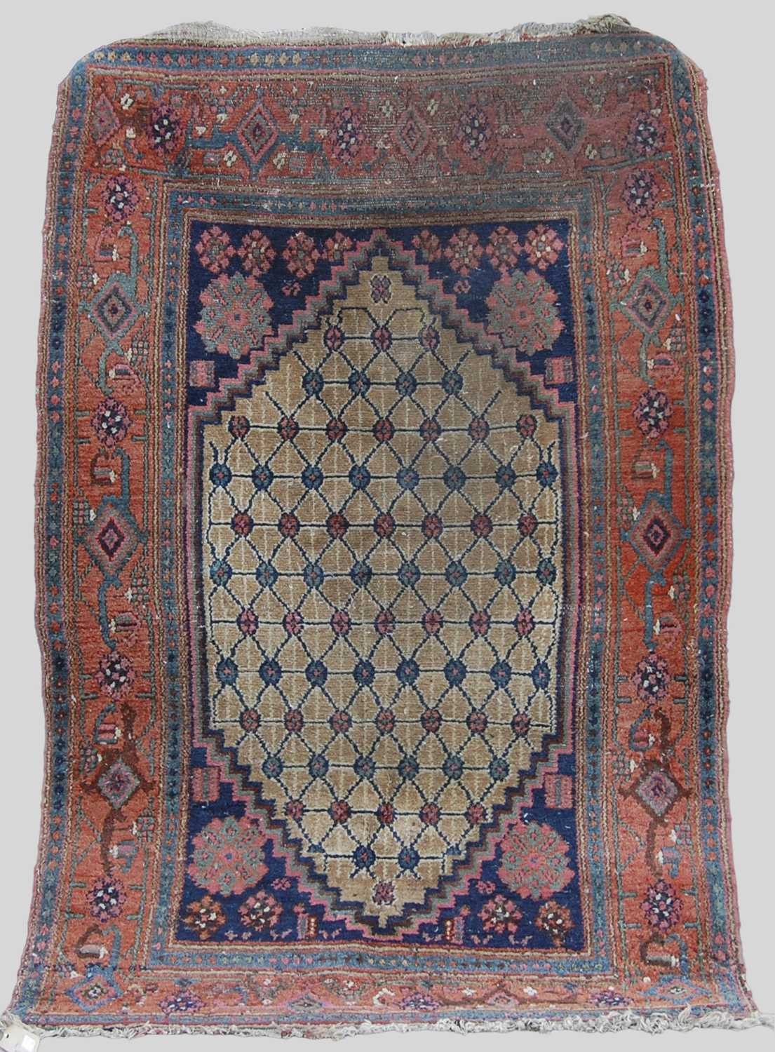 A Persian rug, late 19th/ early 20th century, the rectangular field centred with a lozenge shaped