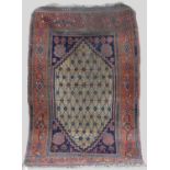 A Persian rug, late 19th/ early 20th century, the rectangular field centred with a lozenge shaped