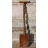 An antique wooden peat spade, 109cm long