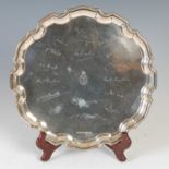 An early 20th century silver salver, Birmingham, makers mark of 'C&K', date letter rubbed,