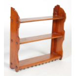 An early 20th century mahogany three-tier hanging shelf, 54.5cm wide x 55cm high