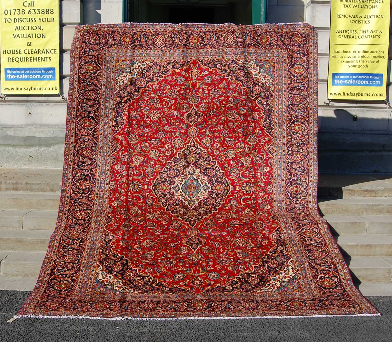 A Persian Kashan carpet, the rectangular field centred with a blue ground oval medallion within a - Bild 2 aus 10