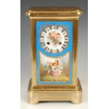 A late 19th century gilt metal porcelain mounted mantel clock, set with three blue ground Sevres