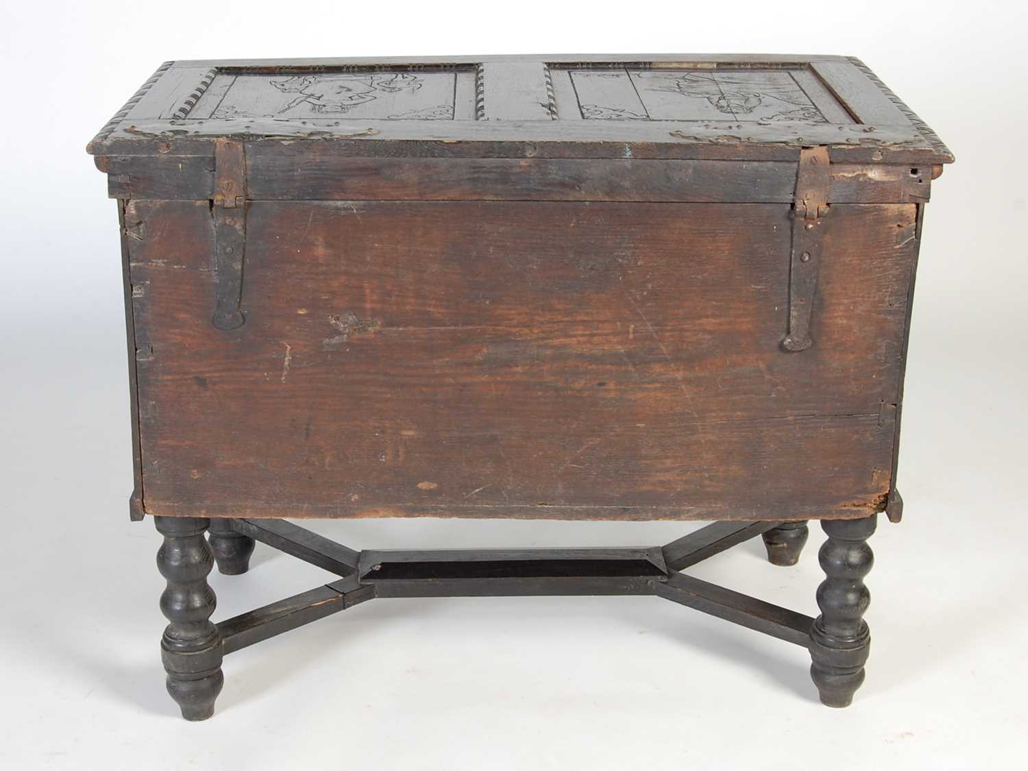 An antique stained oak coffer on integral stand, the hinged cover with two incised figural carved - Image 13 of 13