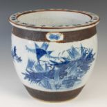 A Chinese porcelain blue and white crackle glazed jardiniere, Qing Dynasty, decorated with a pair of