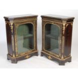 A pair of 19th century Boulle pier cabinets, each with glazed cupboard door opening to a fitted