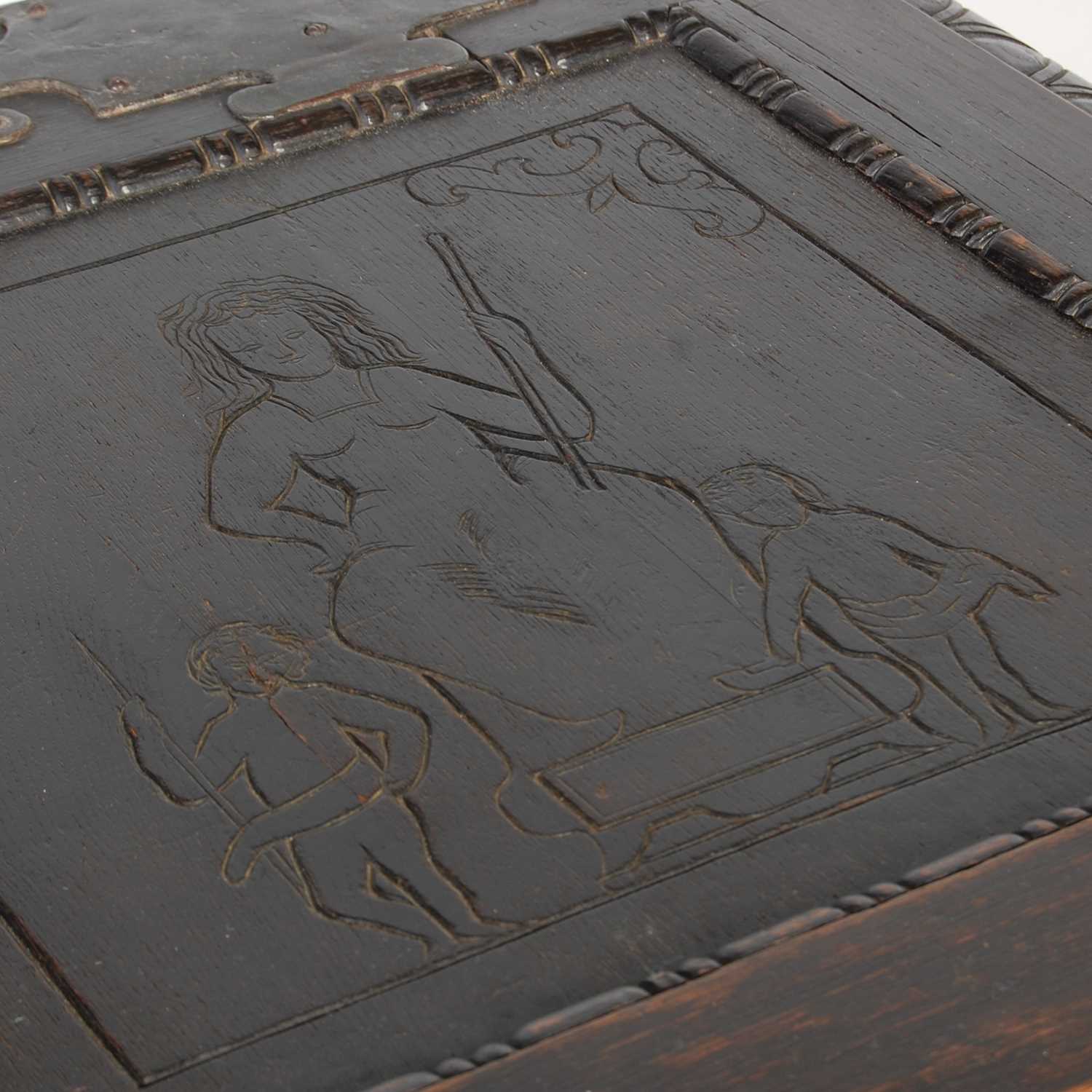 An antique stained oak coffer on integral stand, the hinged cover with two incised figural carved - Image 4 of 13