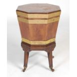 A 19th century mahogany and brass bound octagonal shaped wine cooler on integral stand, the hinged