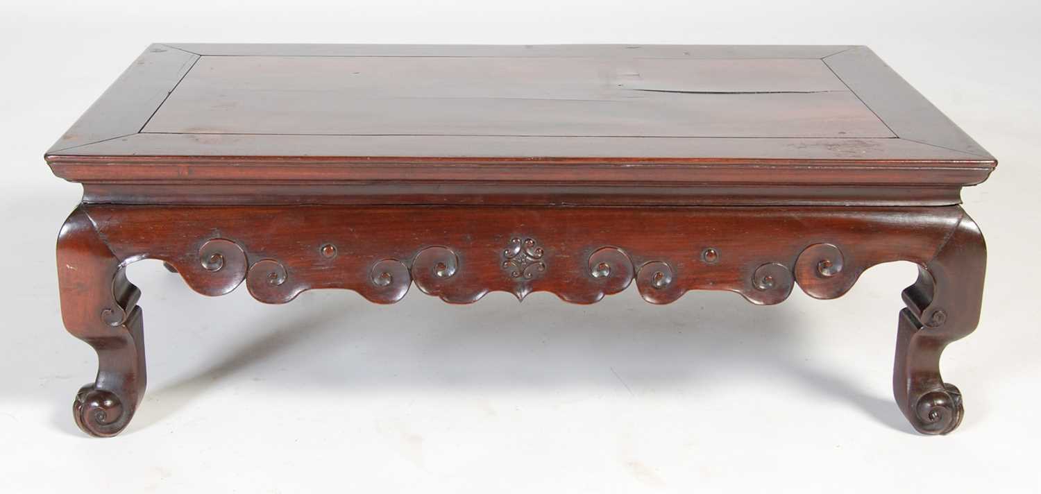 A Chinese dark wood kang table, late 19th/ early 20th century, the panelled rectangular top above - Image 5 of 5