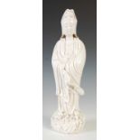 A Chinese porcelain blanc de chine figure of Guanyin, 33.5cm high