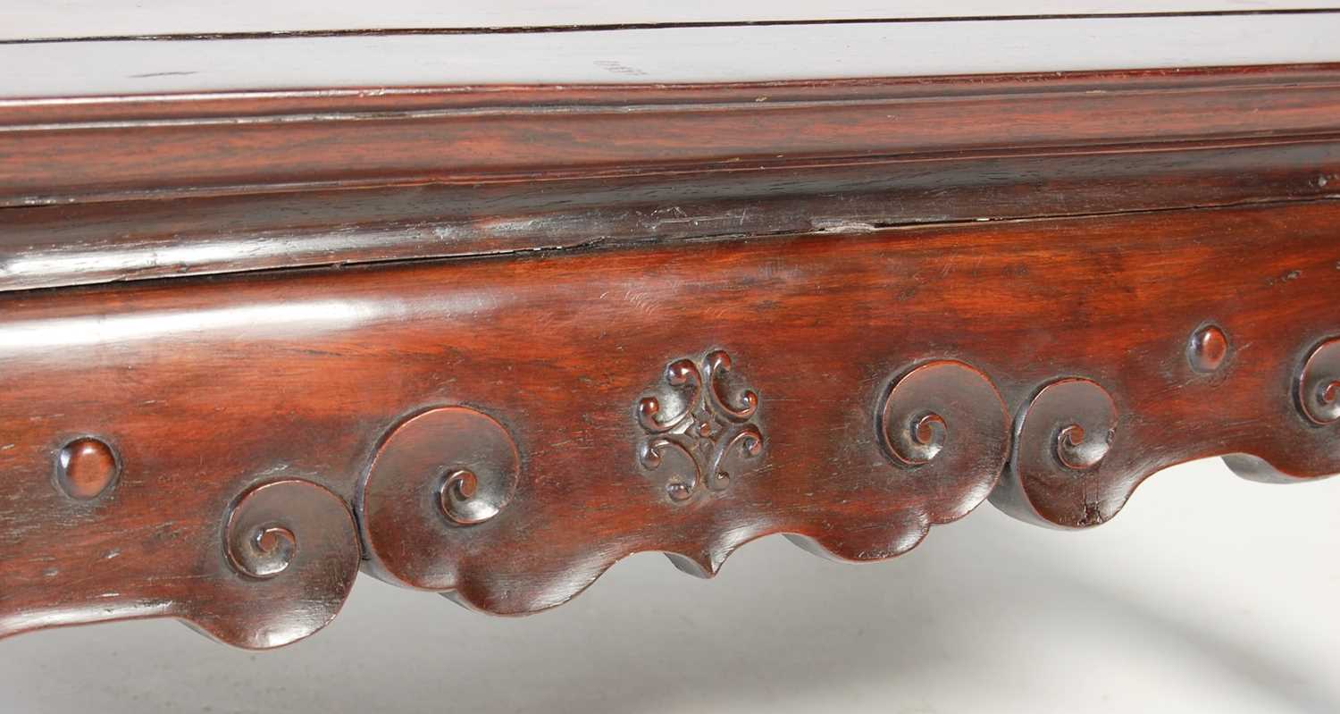 A Chinese dark wood kang table, late 19th/ early 20th century, the panelled rectangular top above - Image 4 of 5