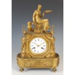 A 19th century Continental gilt metal mantel clock, the black and white circular enamel dial with