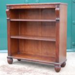 An early 19th century mahogany open bookcase, the rectangular top above two adjustable shelves