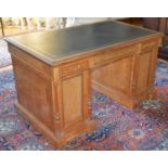 A late 19th century satinwood, ebony and boxwood lined partners desk, the rectangular top with a