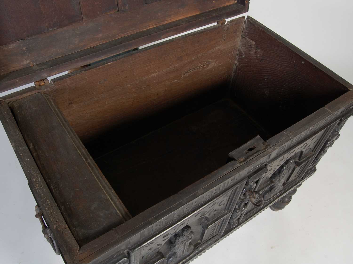 An antique stained oak coffer on integral stand, the hinged cover with two incised figural carved - Image 10 of 13