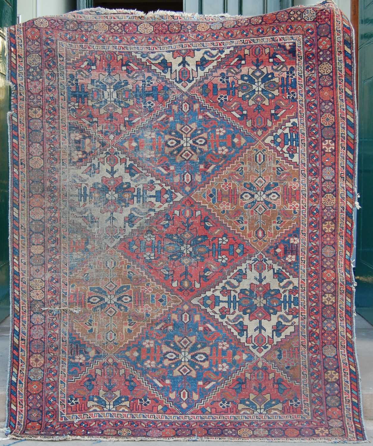 A Persian rug, late 19th/ early 20th century, the rectangular field decorated with lozenge shaped - Bild 2 aus 8