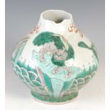 A Chinese porcelain famille verte bottle vase, Qing Dynasty, decorated with four kylin, double