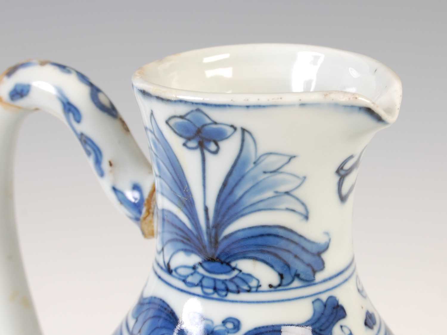 A Chinese porcelain blue and white jug, Qing Dynasty, decorated with three figures in a fenced - Image 7 of 10