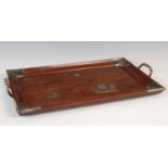 A late 19th/ early 20th century Chinese dark wood and white metal mounted twin-handled tray, of