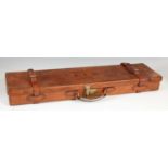 A late 19th/ early 20th century leather gun case, the hinged cover bearing initials 'A.F.G.', the