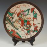 A Chinese porcelain crackle glazed warrior dish, late Qing Dynasty, with incised square character