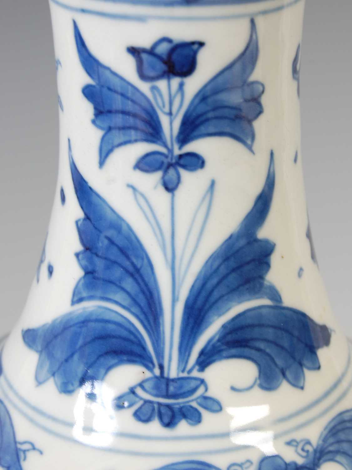 A Chinese porcelain blue and white bottle vase, Qing Dynasty, decorated with scholars and other - Image 5 of 8