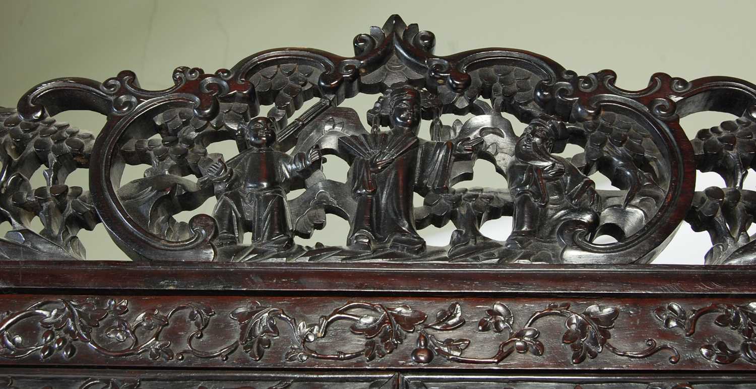 A Chinese dark wood display cabinet/ bookcase, late 19th/ early 20th century, the upper section with - Image 6 of 8